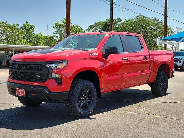 2026 Chevrolet Silverado 1500 Custom Trail Boss in Red Hot — front three-quarter view